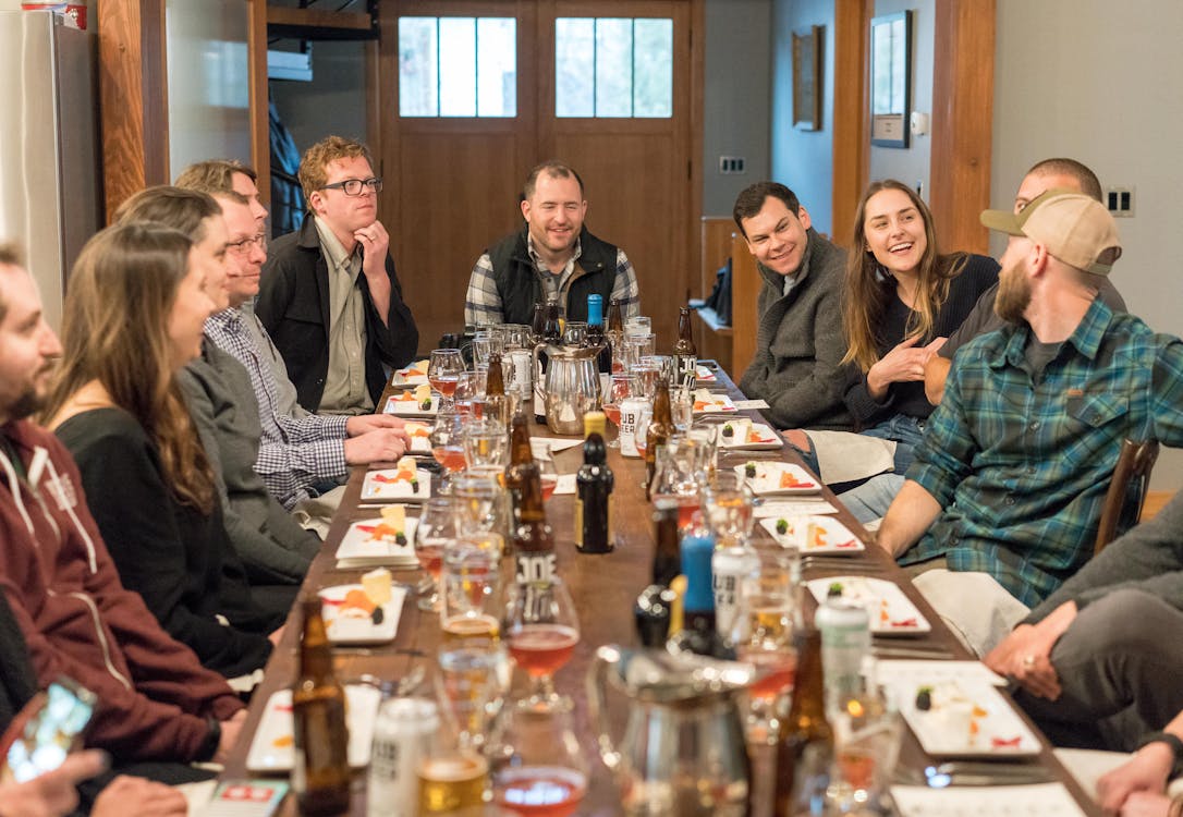 Happy group of friends dining together at a restaurant